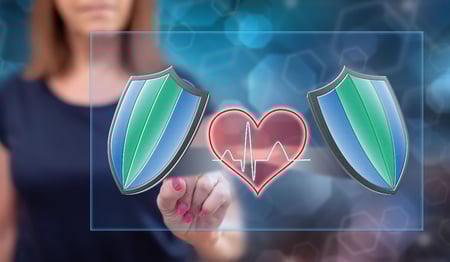 Woman comparing two AED options